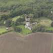 General oblique aerial view of Crichton Parish Church with adjacent churchyard and manse, looking to the NW.