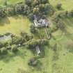 General oblique aerial view of Roseberry House with adjacent Episcopal Chapel, looking to the SW.