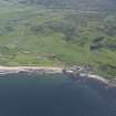 Oblique aerial view of Machrihanish Golf Course and Machrihanish village, looking SSE.