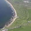 Oblique aerial view of Machrihanish Golf Course and Machrihanish village, looking NE.