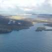 General oblique aerial view of Egilsay with Sullom Voe in the distance, looking NE.