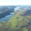 General oblique aerial view of Burra Dale with Scalloway in the distance, looking S.
