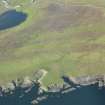 Oblique aerial view of Whalsay Golf Course with the promontory enclosure in the foreground, looking NW.