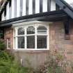 Detail of bay window set into half timbered gable