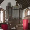 Interior. View of organ at west end of north aisle