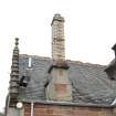 Detail of wallhead chimney stack on north pavilion of station building.