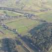 Oblique aerial view of the archaeological evaluation trenches in advance of the A75 Dunragit Bypass construction.