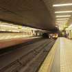 Interior view looking along platform and tracks of Govan Cross Subway Station, 771-5 Govan Road, Glasgow, with trains arriving at both platforms.