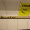 Detail of signage and network map on tunnel wall of St George’s Cross subway station