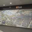 View of left-hand panel and central section of Alasdair Gray mural within Hillhead subway station