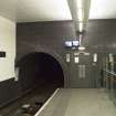 View looking along platform to tunnel openings and fire exit doors within Hillhead subway station