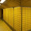 View of tiled corridor linking platform and concourse levels of West Street subway station