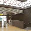 View looking across concourse of West Street subway station to turnstiles and stair leading to platforms