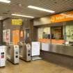 View of ticket office and turnstiles within the concourse of West Street subway station