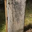 View of cross-incised gravemarker (1) located in graveyard to north of church (flash, including scale)