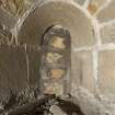 Interior. Detail of blocked c13th arched window above entrance door of the tower,