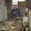 Interior. Rough Out Shed. Ground floor. View of rough out machine (disused) and Mr James Wyllie.
