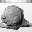 Lead seal, probably from a bale; the design on this face indecipherable. Scale in millimetres.