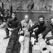 The 1970 team on the pier at North Haven, Fair Isle, with guns recovered from the wreck. From left: Simon Martin, Sydney Wignall, Colin Martin and Chris Oldfield. (photographer unknown)
