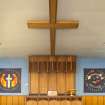 Interior. Sanctuary, view of communion table, seating and cross on ceiling