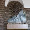 Interior. Organ pipes and latticed brick archway