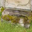 Oblique view of font or possible bullaun stone built into east wall of burial ground