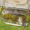 Oblique view of font or possible bullaun stone (with scale), built into east wall of burial ground