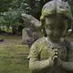 Detail of statue showing an angel in prayer, from Warriston Cemetery, Edinburgh