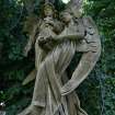 Detail of statue showing two angels, surrounded by foliage, Dean Cemetery, Edinburgh.