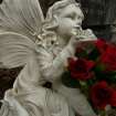 Detail of a statue of an angel, Roslin Cemetery, Roslin, Midlothian.
