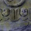 Detail of relief showing the faces and wings of two angels, with wreath above. The Howff Burial Ground, Dundee.