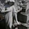 Detail of a statue of an angel holding a garland of flowers, Mount Vernon Cemetery, Edinburgh.