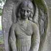 Detail of headstone with angel relief, Dean Cemetery, Edinburgh.