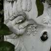 Detail of headstone with angel relief, The Grange Cemetery, Edinburgh.