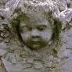 Detail of relief showing the head and wings of an angel, the Cathedral Graveyard, St. Andrews.