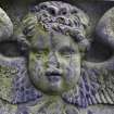 Detail of relief showing the face and wings of an angel, The Howff Burial Ground, Dundee.