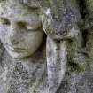 Image of relief showing the head of an angel, Piershill Cemetery, Edinburgh.