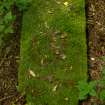 View of toppled gravestone covered in moss, Newington Cemetery, Edinburgh.