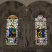 Detail of stained glass windows in chancel depicting the Crucifixion and Resurrection by Stephen Adam Studios of Glasgow.