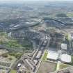 Oblique aerial view of the construction of the Glasgow Commonwealth games site, looking to the S.