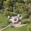 Oblique aerial view of the buildings near Auchmacoy Country House, looking to the S.