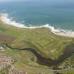 General oblique aerial view of Craigewan Links centred on Peterhead Golf Courses, looking to the NE.