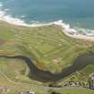 General oblique aerial view of Craigewan Links centred on Peterhead Golf Courses, looking to the NNE.