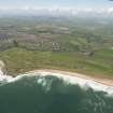 General oblique aerial view of Craigewan Links centred on Peterhead Golf Courses, looking to the WSW.