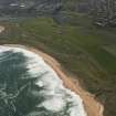 General oblique aerial view of Craigewan Links centred on Peterhead Golf Courses, looking to the SW.