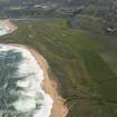 General oblique aerial view of Craigewan Links centred on Peterhead Golf Courses, looking to the S.