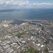 General oblique aerial view of Leith Docks centred on the Caledonia Flour Mills, looking to the ENE.