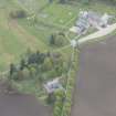 General oblique aerial view of Dunecht House, chapel and stable blocks, looking to the SW.