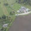 General oblique aerial view of Dunecht House, chapel and stable blocks, looking to the S.