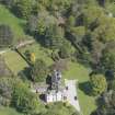 Oblique aerial view of Corsindae House with adjacent walled garden, looking to the E.